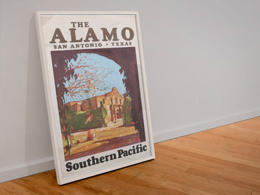 The Alamo Southern Pacific poster in a white frame leaning against a wall