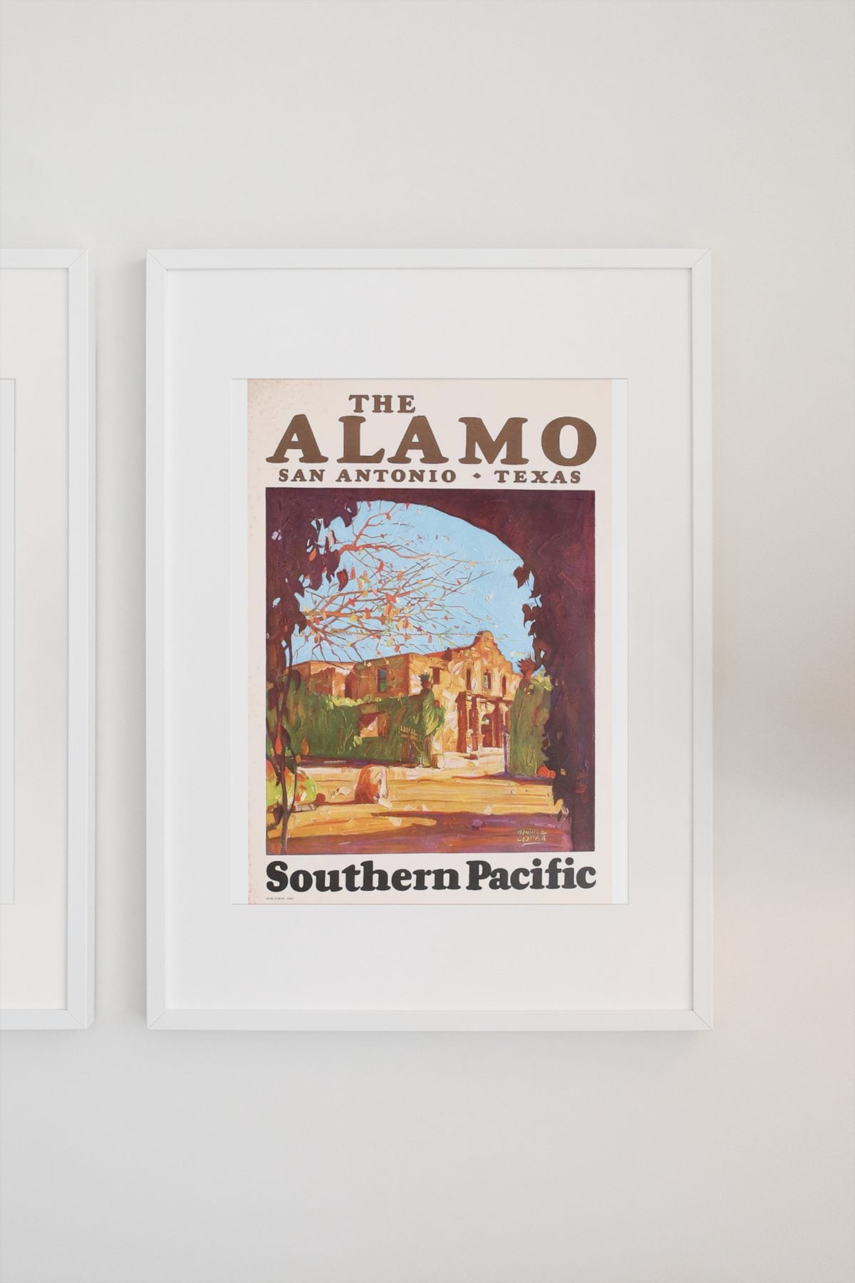The Alamo Southern Pacific poster on a light wall