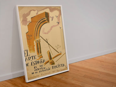 The Art of Spain Is a Target poster in a white frame leaning against a wall