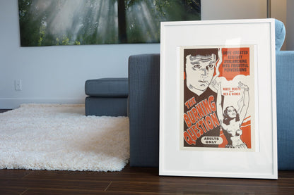 The Burning Question poster leaning beside a blue sofa