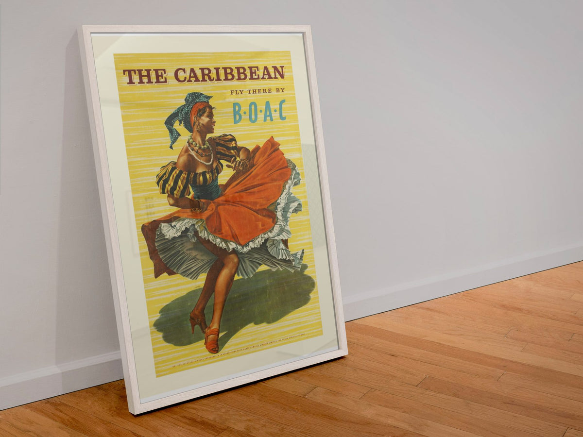 The Caribbean BOAC poster in a white frame leaning against a wall