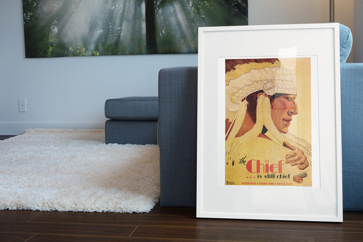 The Chief Santa Fe poster leaning beside a blue sofa