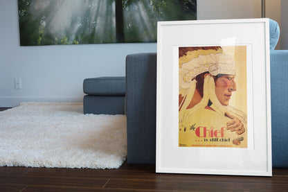 The Chief Santa Fe poster leaning beside a blue sofa
