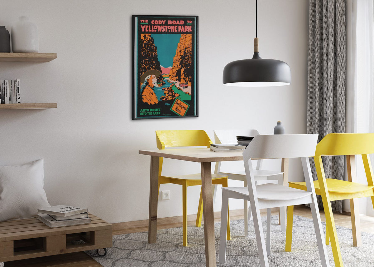 Cody Road to Yellowstone poster framed above a dining table