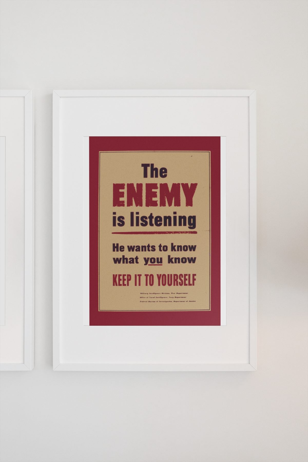 The Enemy Is Listening poster on a light wall