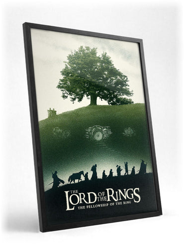 The Lord of the Rings: The Fellowship of the Ring (2001) Shire Tree Art poster in a black frame with glass leaning against a wall