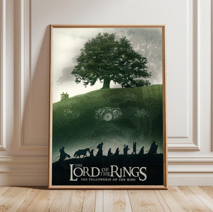 The Lord of the Rings: The Fellowship of the Ring (2001) Shire Tree Art poster in a light oak frame leaning against a white wall