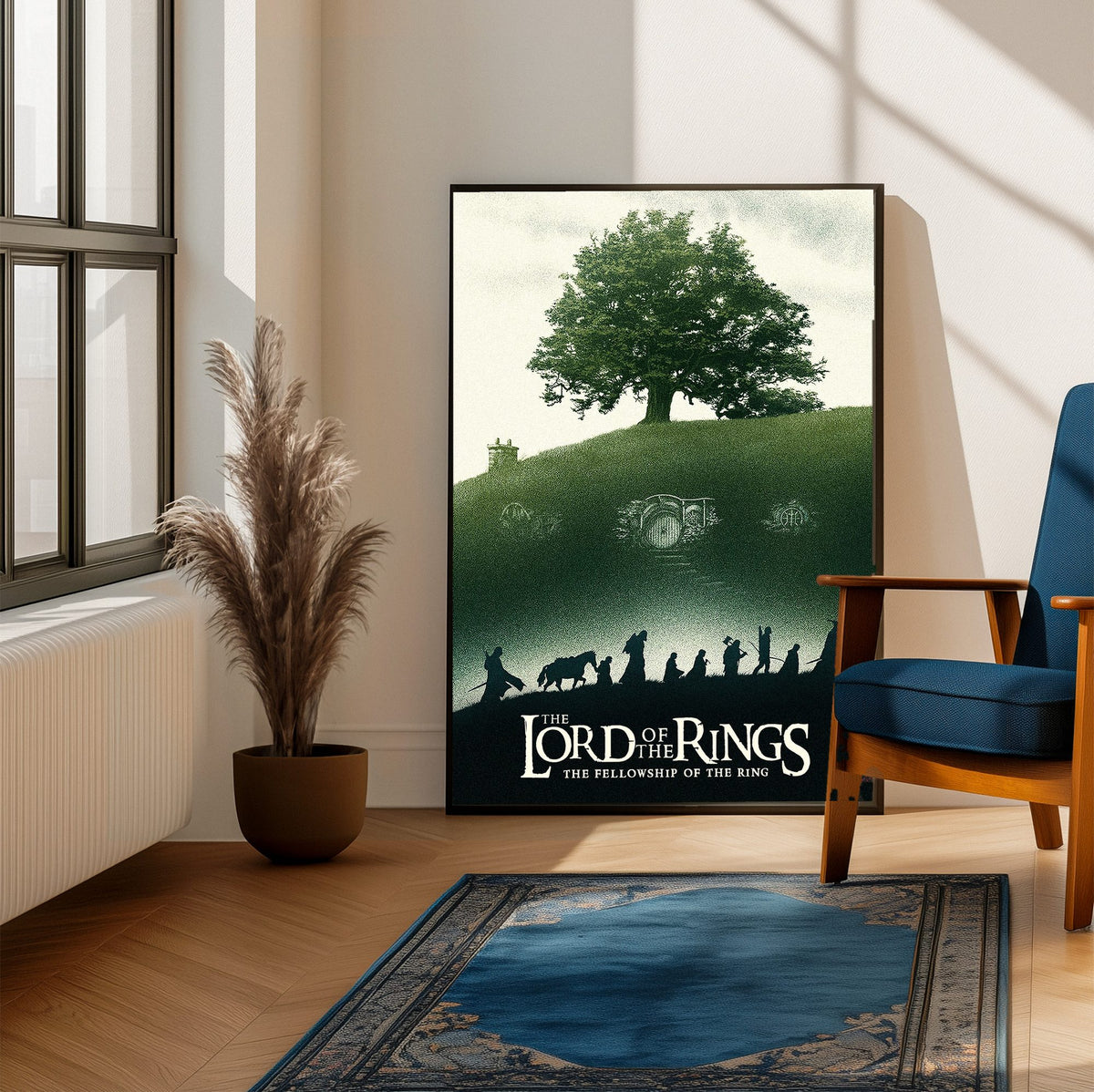 The Lord of the Rings: The Fellowship of the Ring (2001) Shire Tree Art poster framed beside a blue armchair in a sunlit room