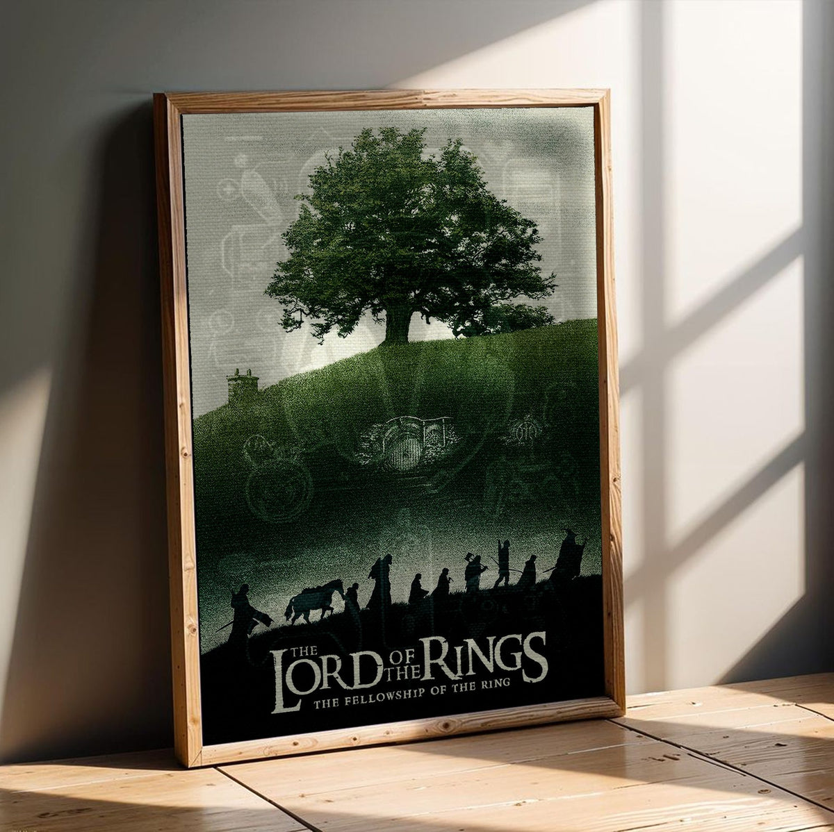 The Lord of the Rings: The Fellowship of the Ring (2001) Shire Tree Art poster in an oak frame leaning on a wooden floor