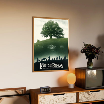 The Lord of the Rings: The Fellowship of the Ring (2001) Shire Tree Art poster in an oak frame above a sideboard