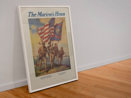 The Marines Hymn poster in a white frame leaning against a wall