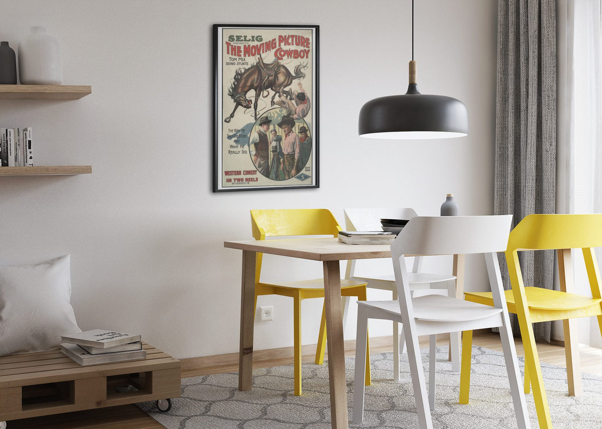 The Moving Picture Cowboy Tom Mix poster framed above a dining table