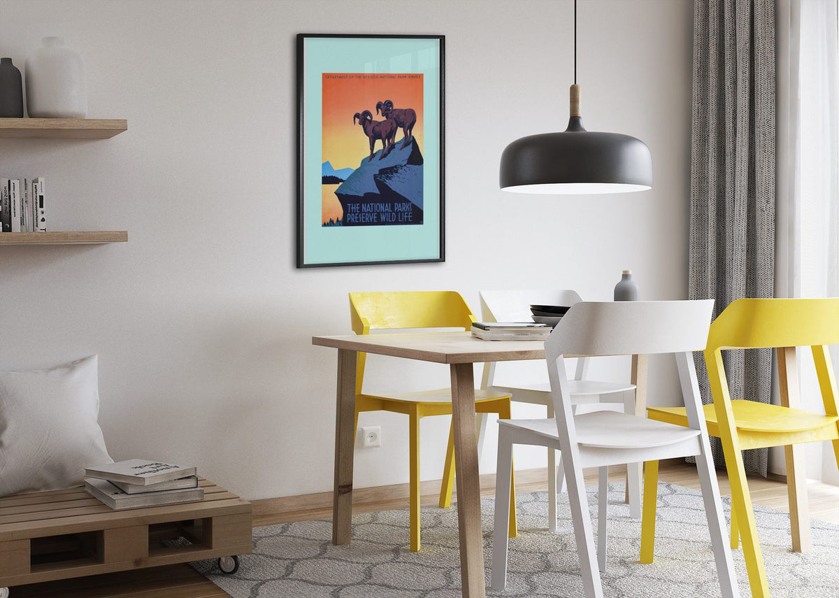 The National Parks Preserve Wild Life poster framed above a dining table