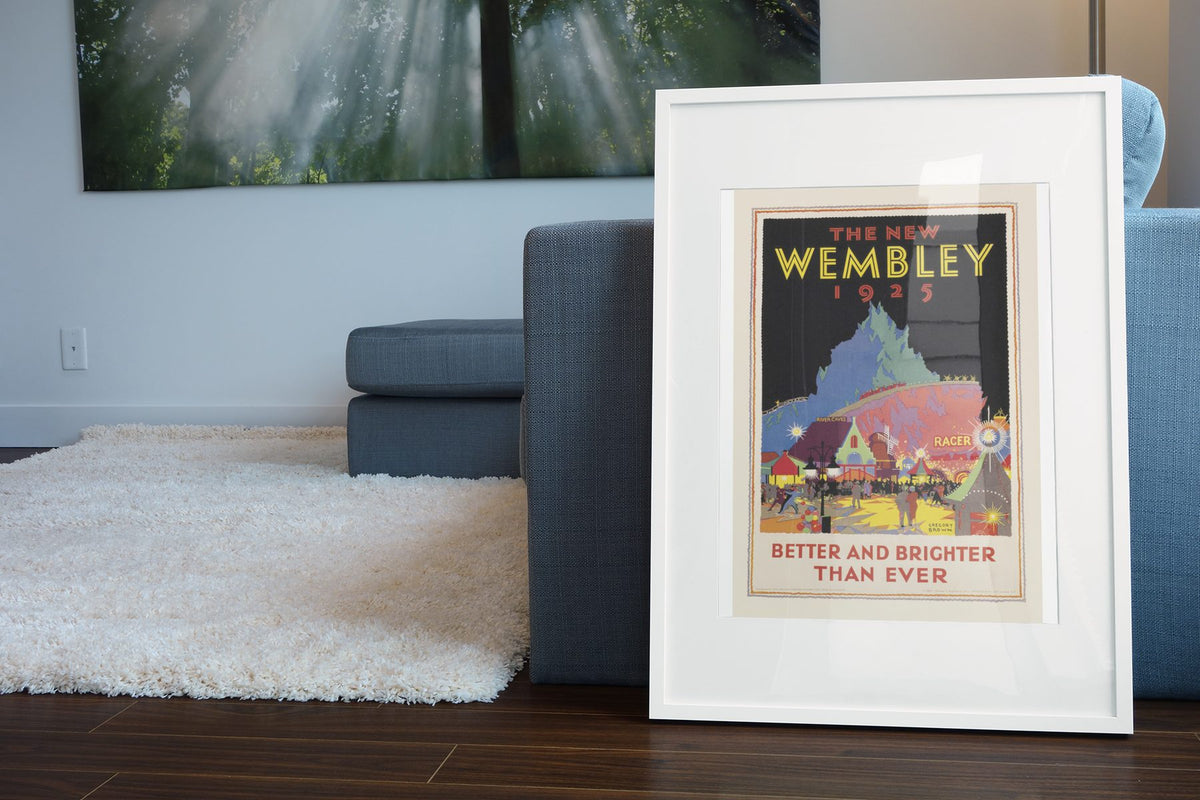 The New Wembley 1925 poster leaning beside a blue sofa