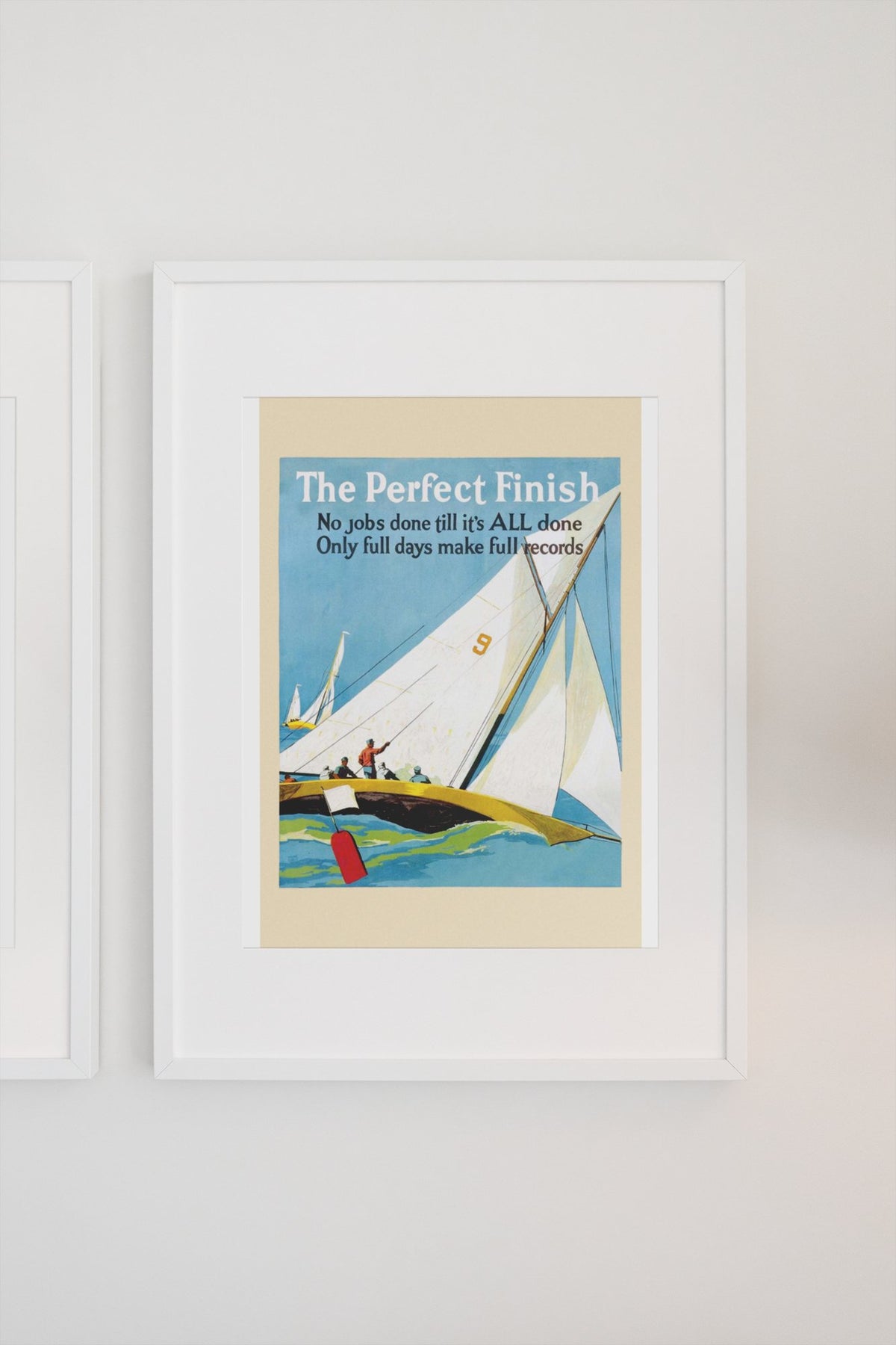 The Perfect Finish poster in a white frame on a light wall