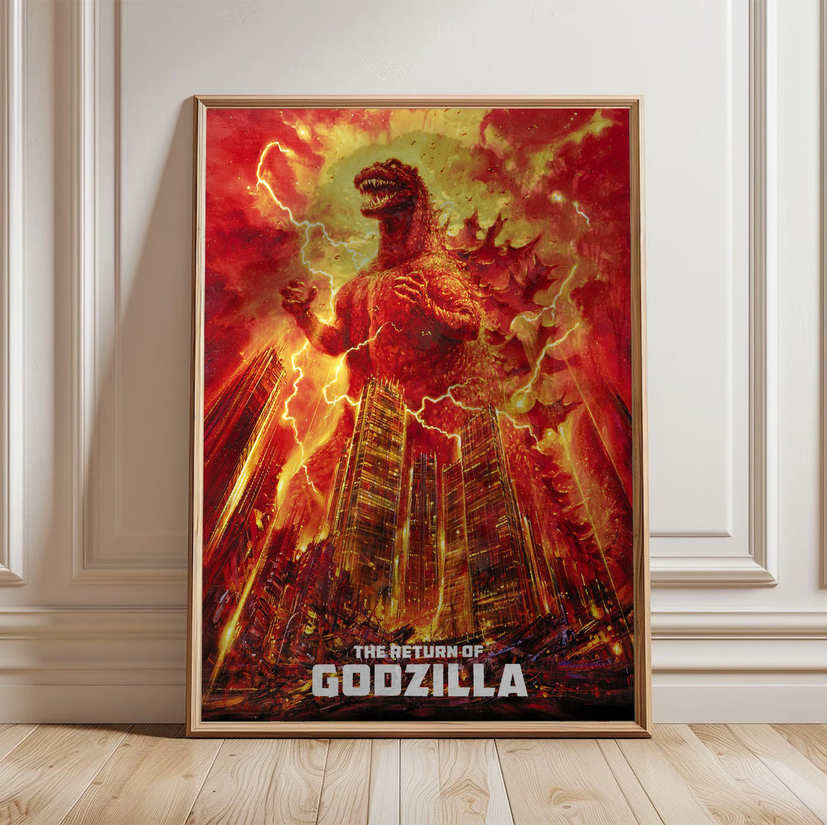 The Return of Godzilla (1984) Movie Illustrated Art poster in a light oak frame leaning against a white wall