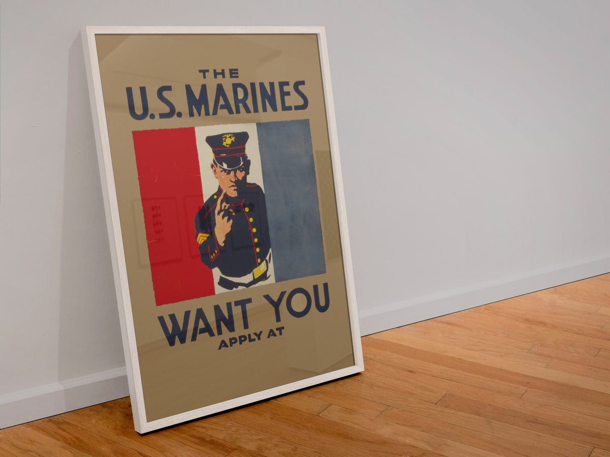 The US Marines Want You poster in a white frame leaning against a wall