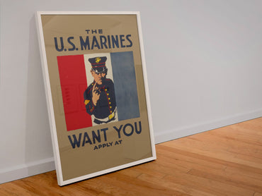 The US Marines Want You poster in a white frame leaning against a wall