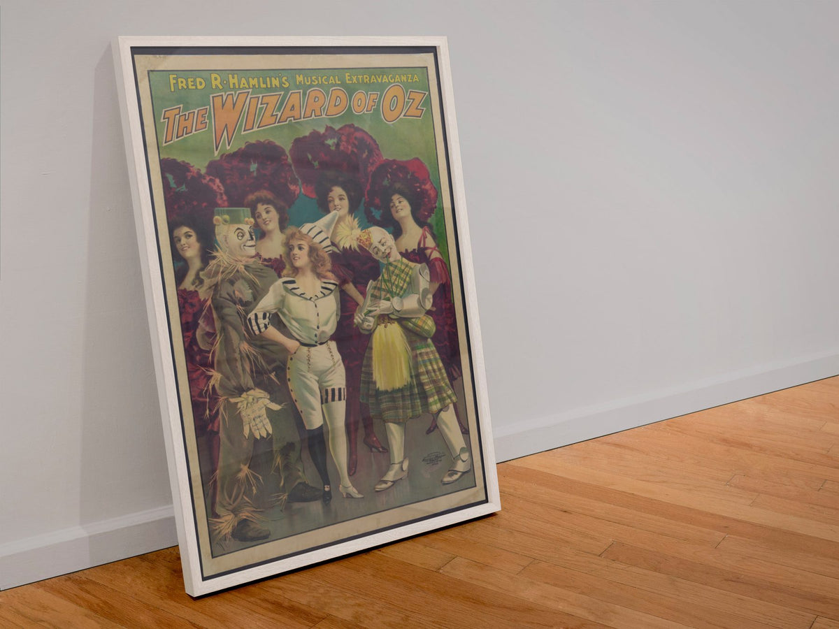 The Wizard of Oz Stage Musical poster in a white frame leaning against a wall