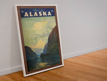 This Is Alaska poster in a white frame leaning against a wall