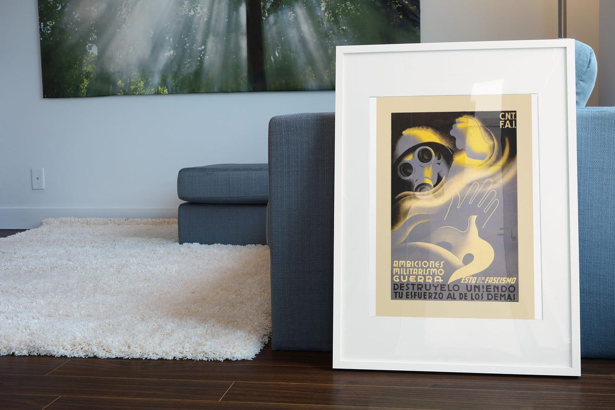 This Is Fascism Destroy It poster leaning beside a blue sofa
