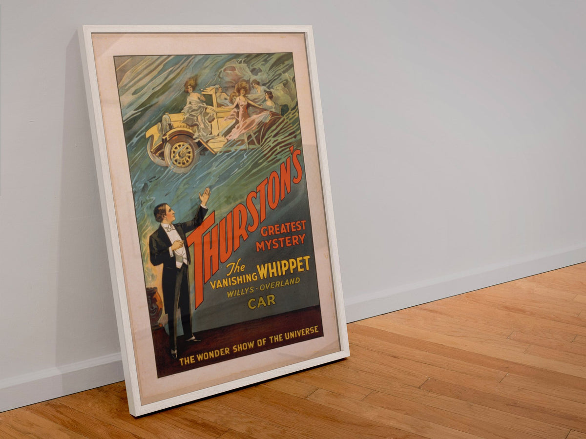 Thurston Vanishing Whippet Car poster in a white frame leaning against a wall