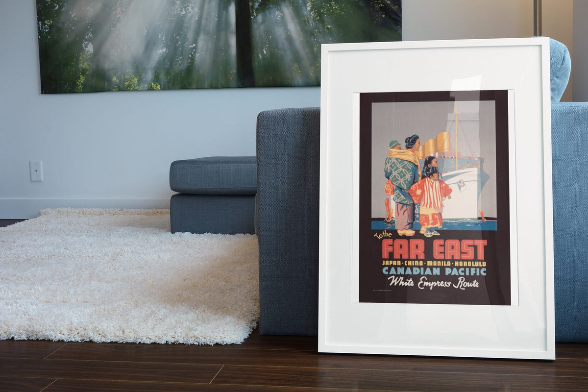 To the Far East Canadian Pacific poster leaning beside a blue sofa