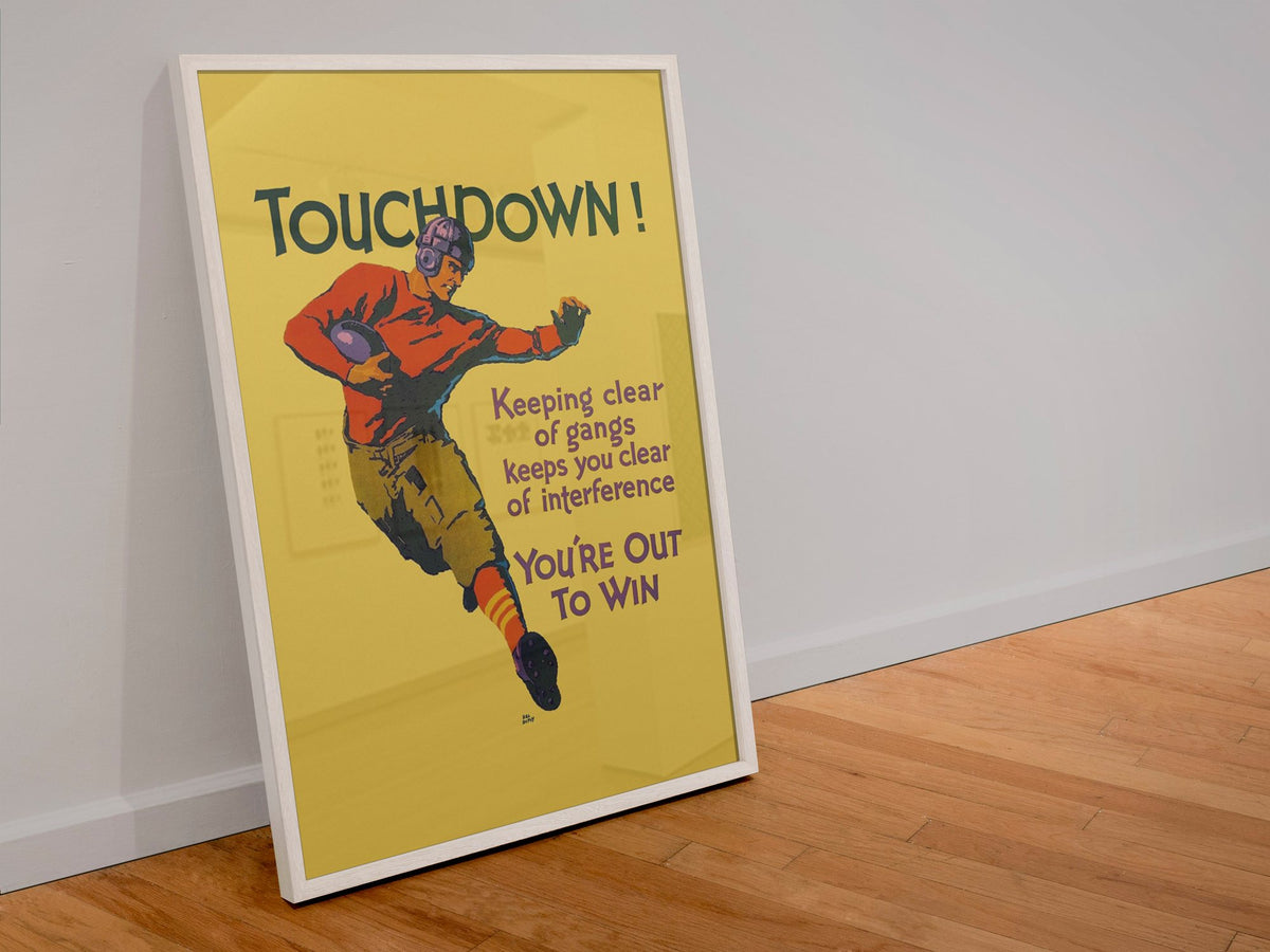 Touchdown poster in a white frame leaning against a wall