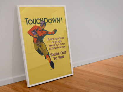 Touchdown poster in a white frame leaning against a wall