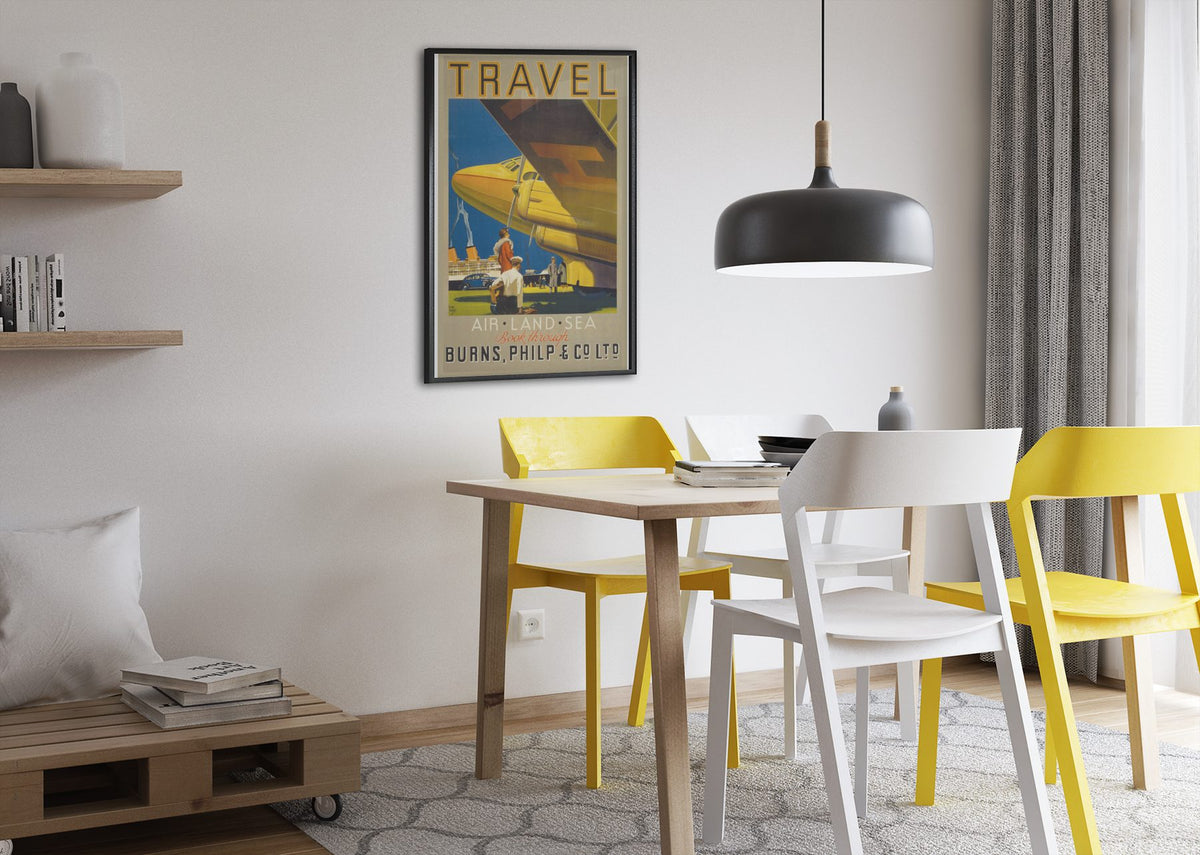 Travel Air Land Sea Burns Philp poster framed above a dining table