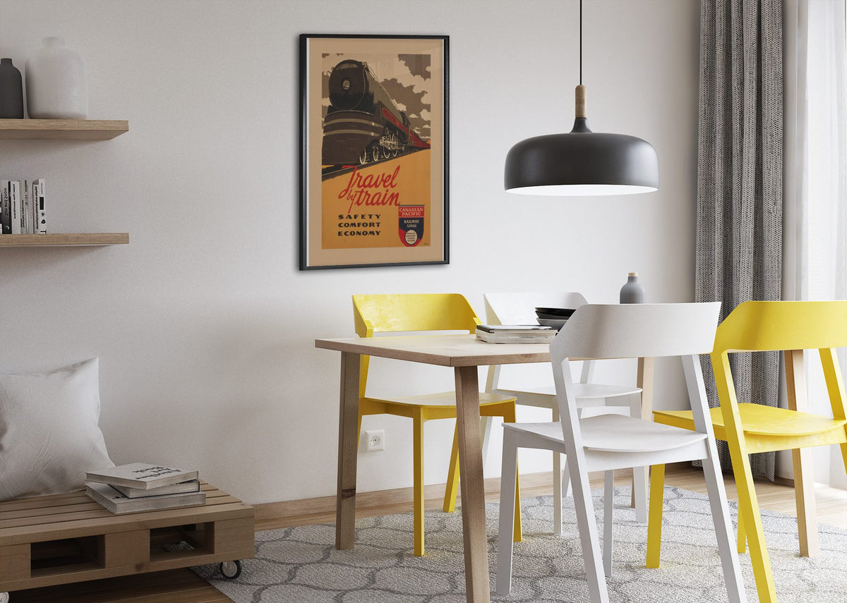 Travel by Train Canadian Pacific poster framed above a dining table