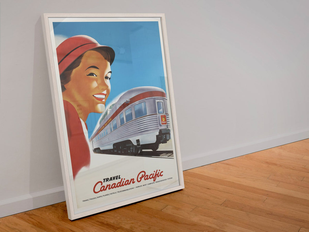 Travel Canadian Pacific 1948 poster in a white frame leaning against a wall