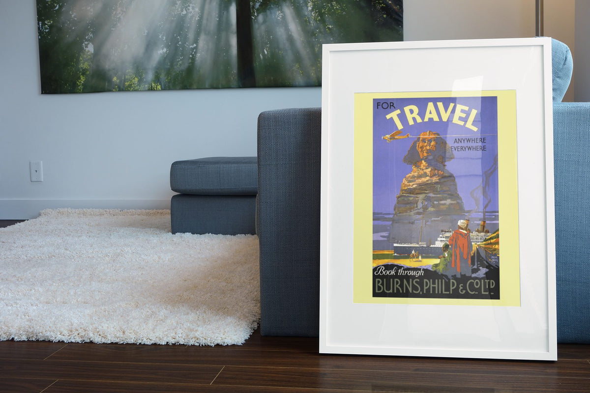 Travel to Egypt Burns Philp poster leaning beside a blue sofa