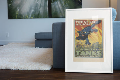 Treat Em Rough Join the Tanks poster leaning beside a blue sofa