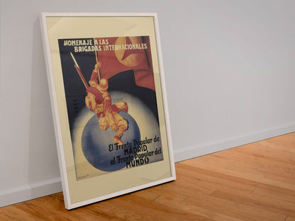 Tribute to the International Brigades poster in a white frame leaning against a wall