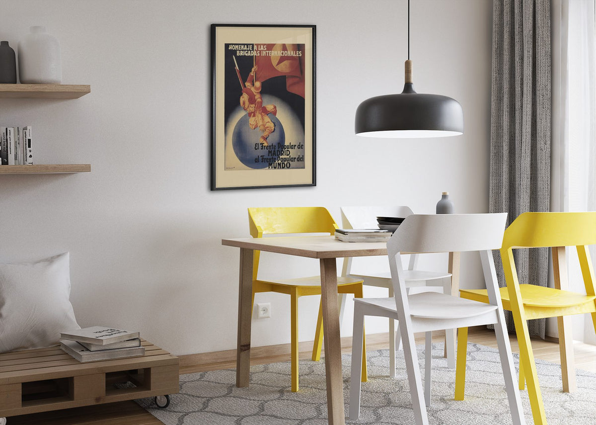 Tribute to the International Brigades poster framed above a dining table