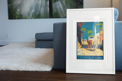 Tripoli Libia poster leaning beside a blue sofa