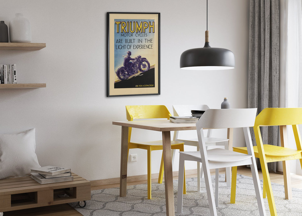 Triumph Motorcycles poster framed above a dining table