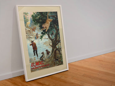 UMC Cartridges Bear Hunt poster in a white frame leaning against a wall