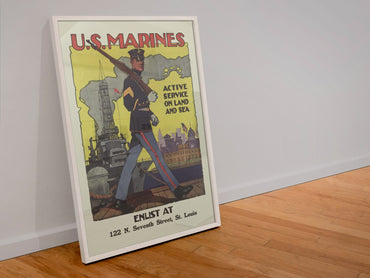 US Marines Active Service on Land and Sea poster in a white frame leaning against a wall