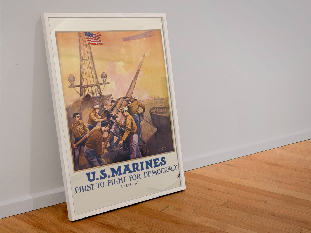 US Marines First to Fight for Democracy poster in a white frame leaning against a wall