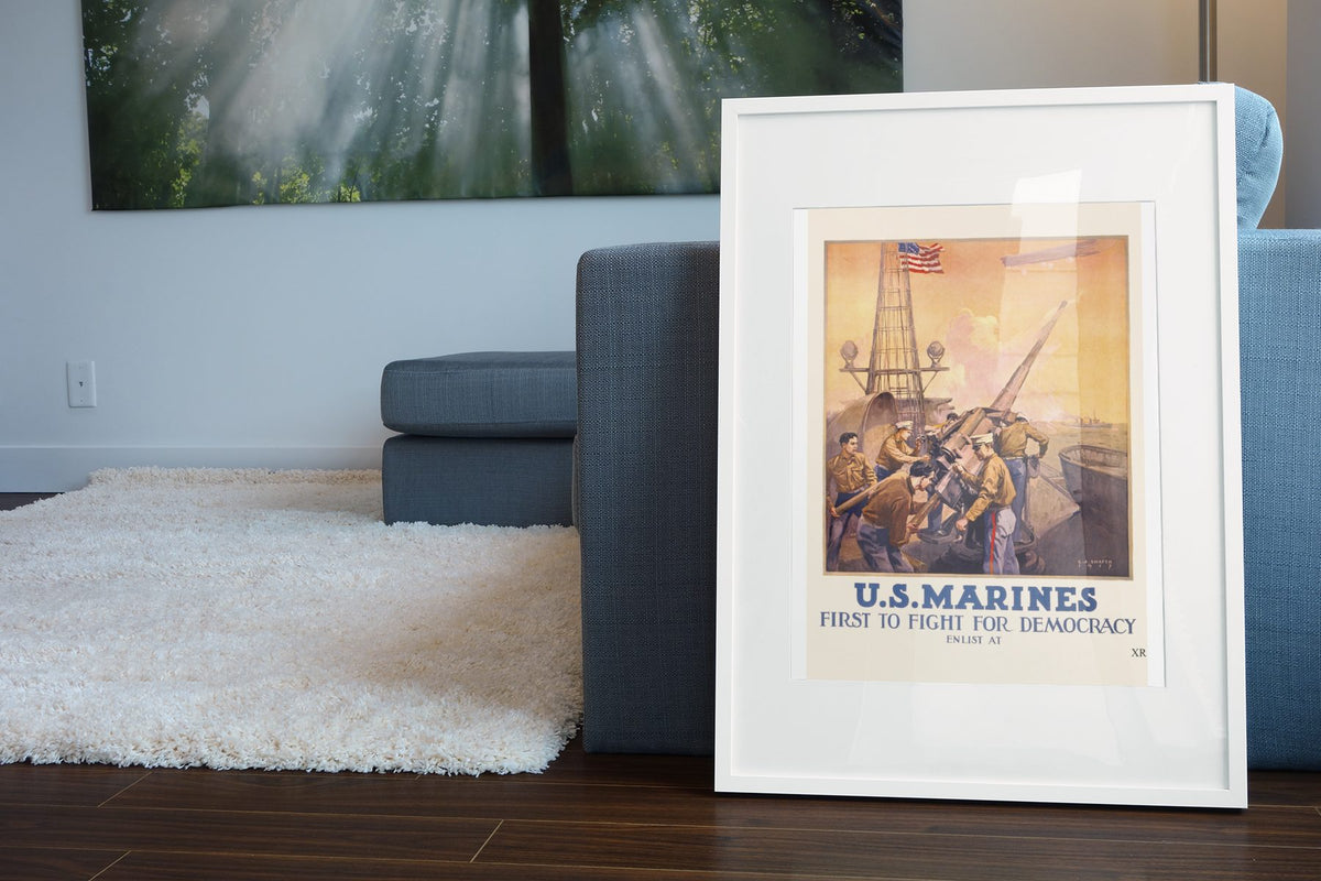 US Marines First to Fight for Democracy poster leaning beside a blue sofa