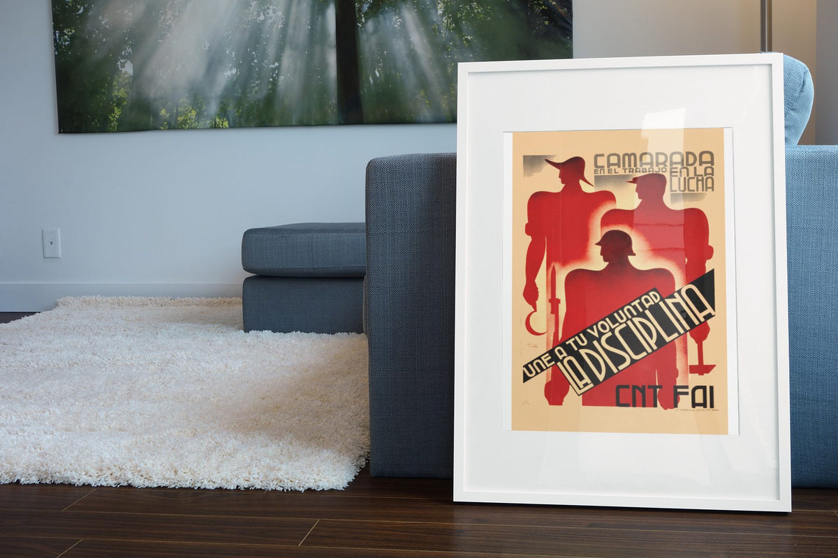 Unite Your Will With Discipline poster leaning beside a blue sofa