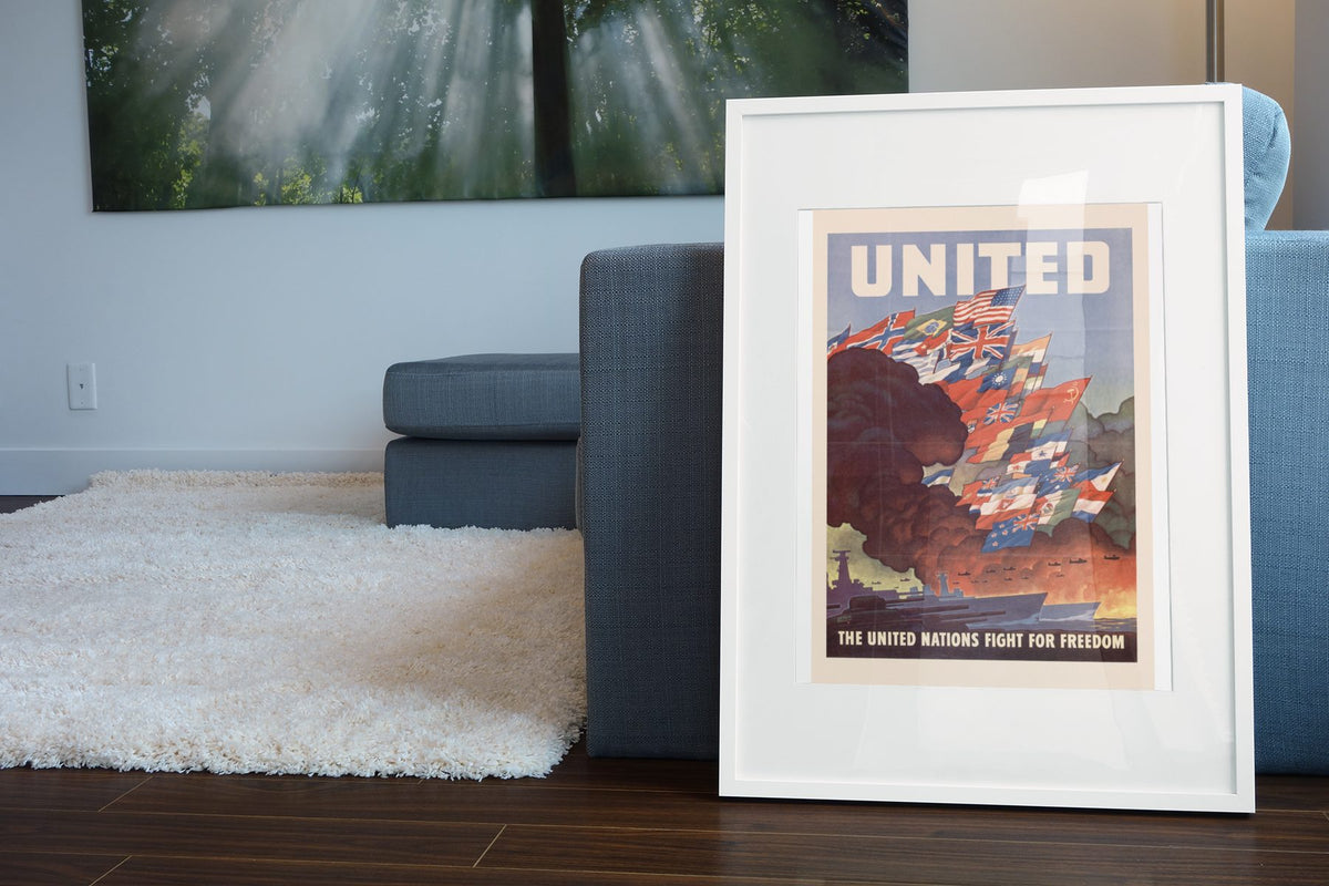 United — The United Nations Fight for Freedom poster leaning beside a blue sofa