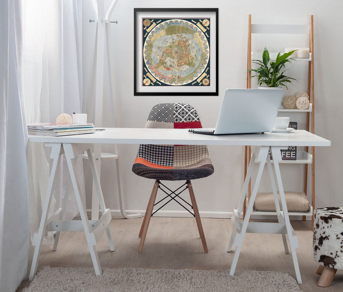 Urbano Monte World Map 1587 print framed above a white desk in a home office