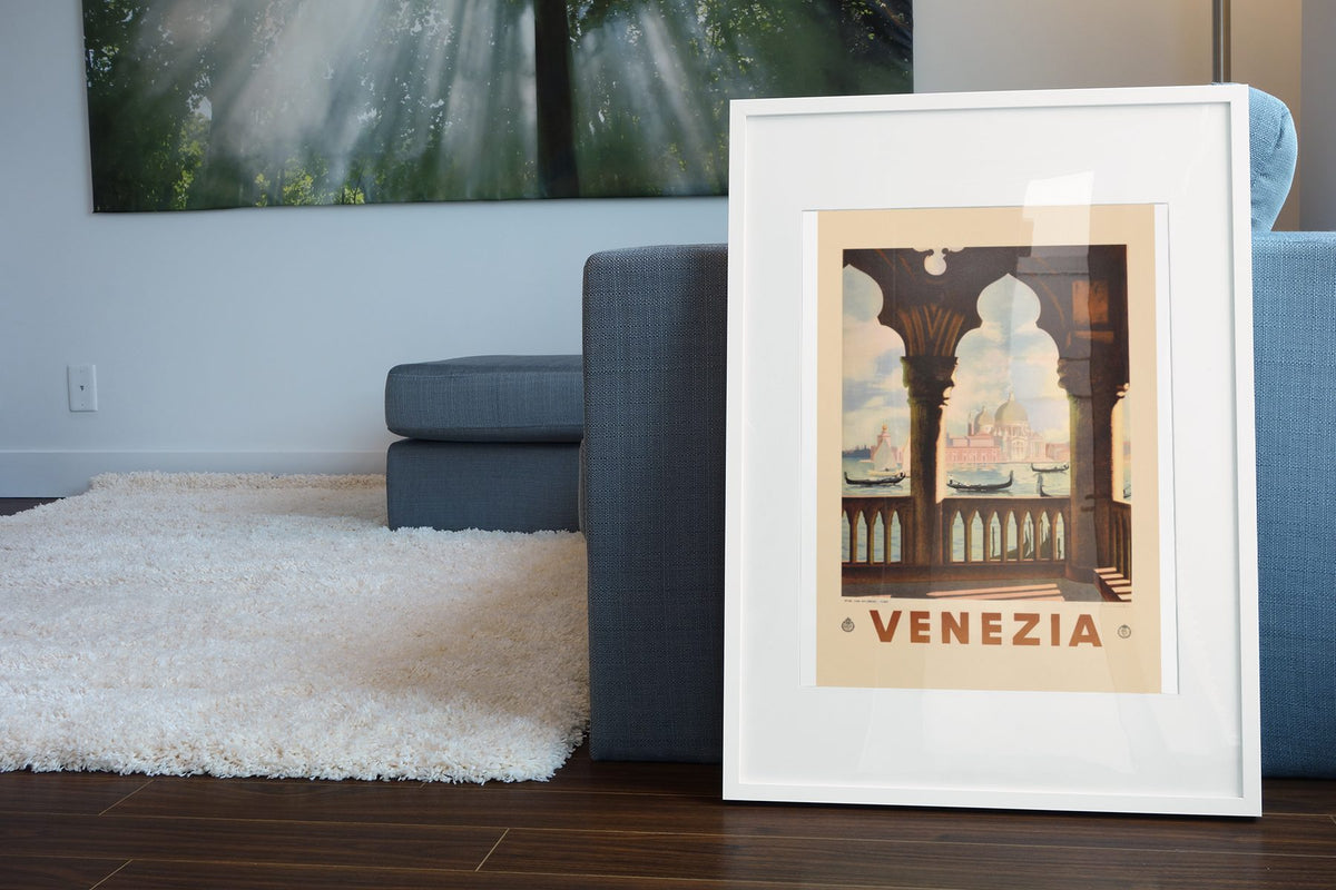 Venezia St Marks Basilica poster leaning beside a blue sofa