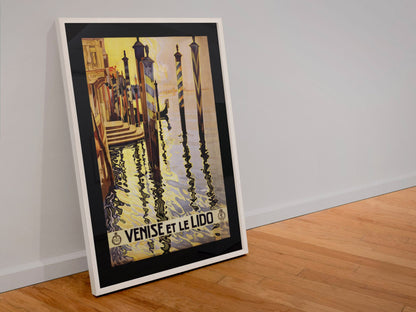 Venise et le Lido poster in a white frame leaning against a wall