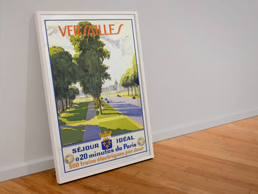 Versailles Sejour Ideal poster in a white frame leaning against a wall