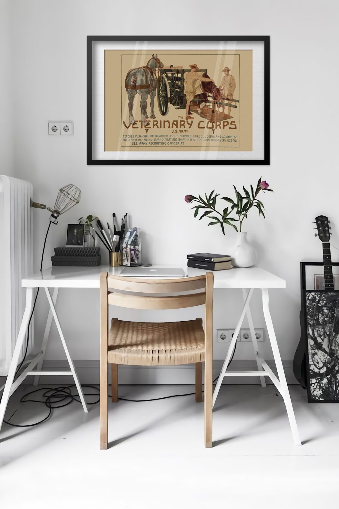 Veterinary Corps U.S. Army poster framed above a desk in a bright white room