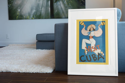 Visit Cuba Rumba Dancer poster leaning beside a blue sofa